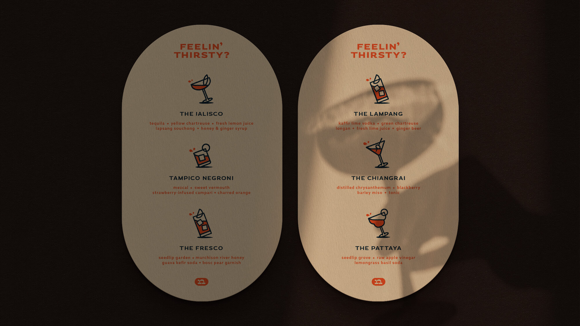 Oval-shaped menu designs printed on textured stock.